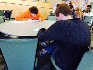 A few minutes into the annual WriteOff competition, Peter Warren, left, of Scotch Plains-Fanwood High School, and Bryan Gallion of West Essex High School, get down to the writing. They were two of 15 contestants for the grand prize â€“ a $100 award from The Bergen Record, sponsors of the competition.