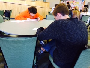 A few minutes into the annual WriteOff competition, Peter Warren, left, of Scotch Plains-Fanwood High School, and Bryan Gallion of West Essex High School, get down to the writing. They were two of 15 contestants for the grand prize – a $100 award from The Bergen Record, sponsors of the competition.